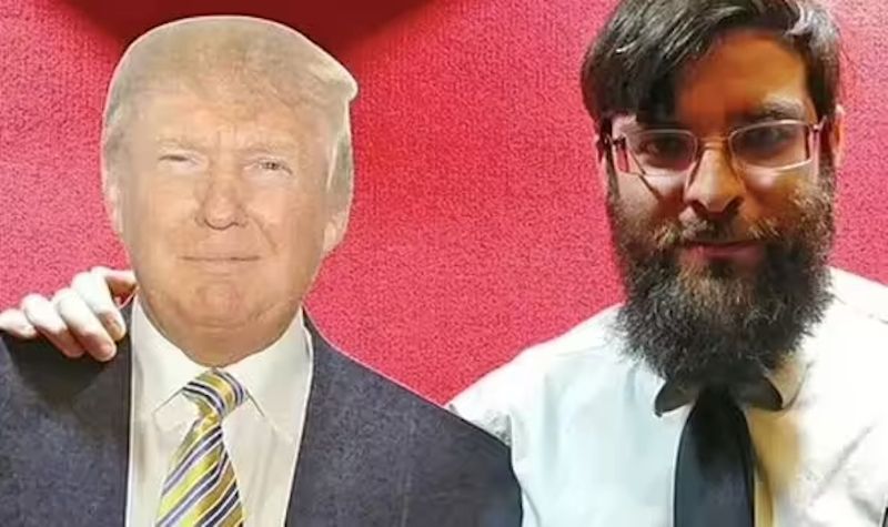 Domestic terrorist Taylor Taranto poses with a cutout of Donald Trump