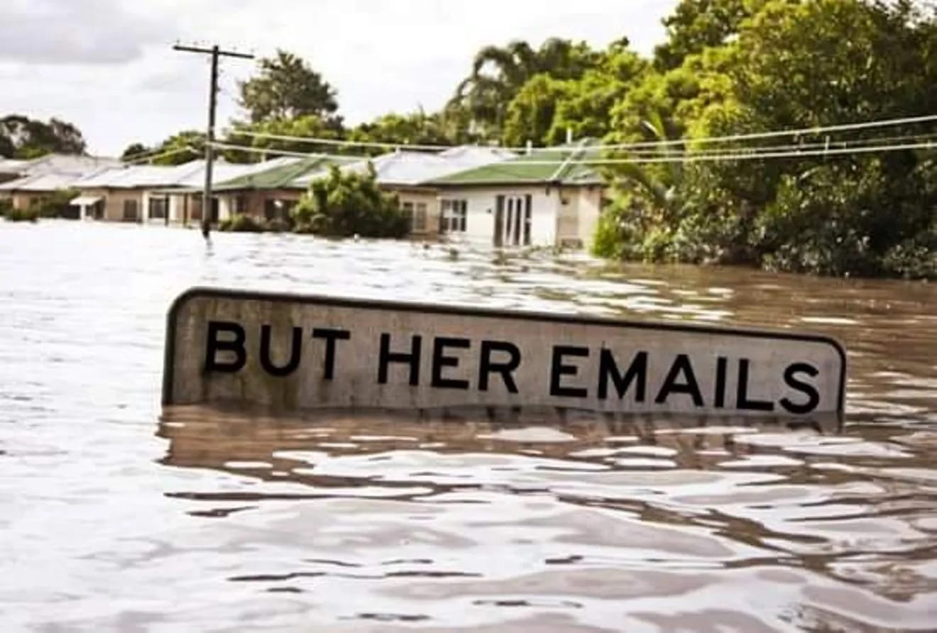 "But Here Emails" sign submerged in floodwaters - meme from 2016